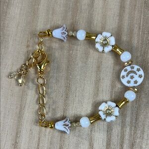 SOLD…Gold and White Beaded Floral Bracelet with Charms